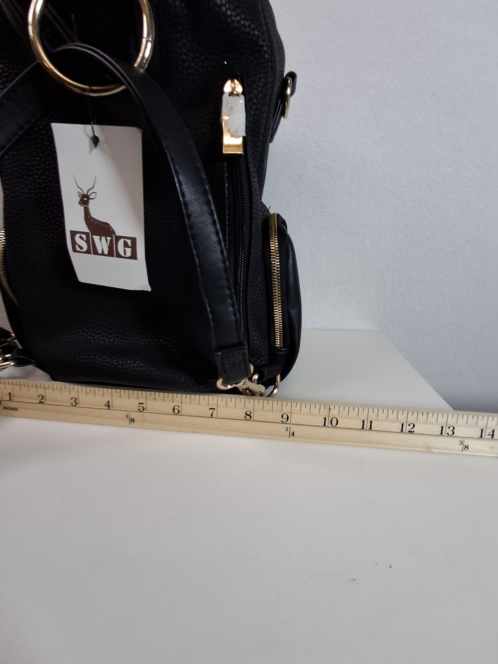SWG Black Pebbled Sling Barrel Backpack with Gold Accents - Picture 11 of 11
